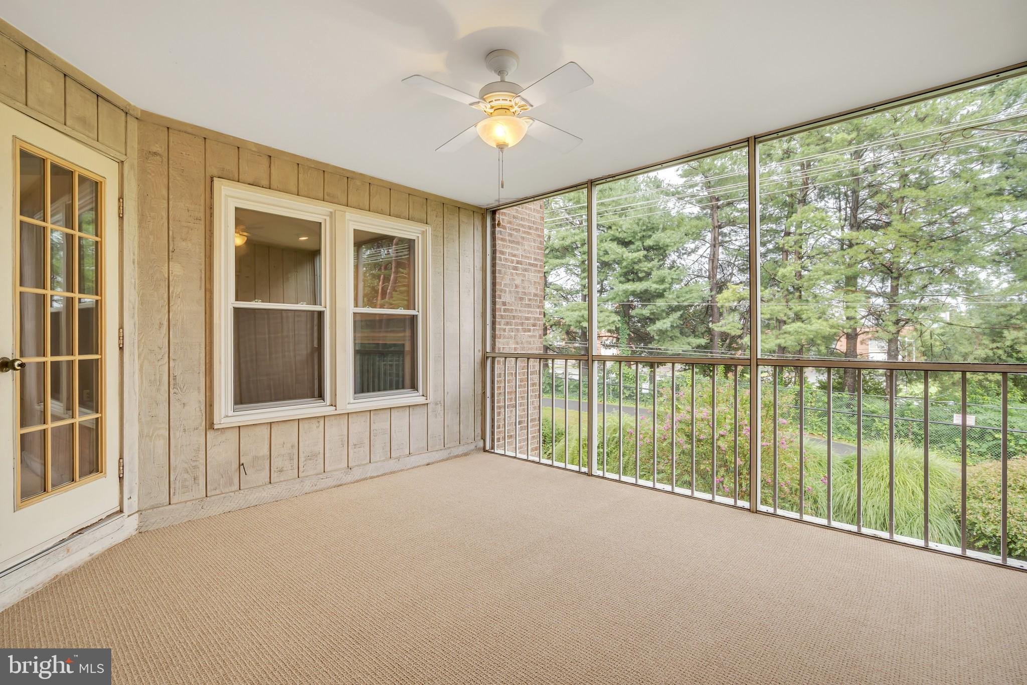 10717 Kings Riding Way, Unit 202 Rockville, MD 20852 - Photo 17 of 34 Lovely screened porch overlooking lush landscape