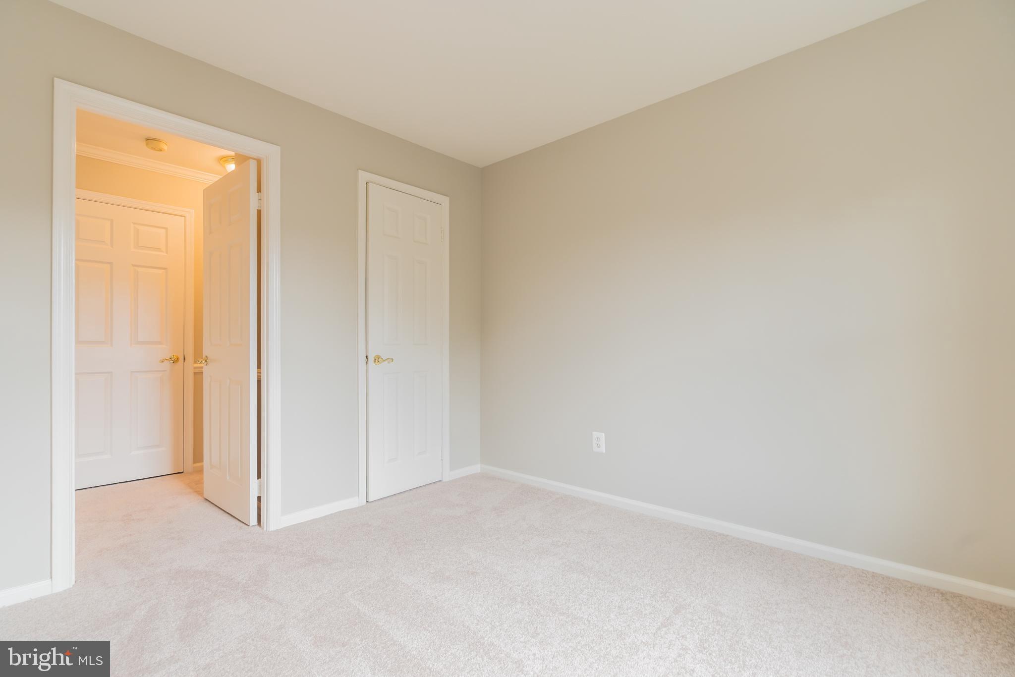 10717 Kings Riding Way, Unit 202 Rockville, MD 20852 - Photo 27 of 34 Bedroom #2 showing closet and hallway