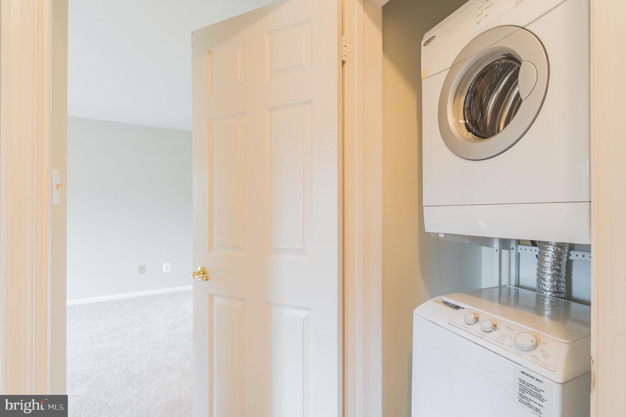 10717 Kings Riding Way, Unit 202 Rockville, MD 20852 - Photo 29 of 34 Washer and dryer in the unit