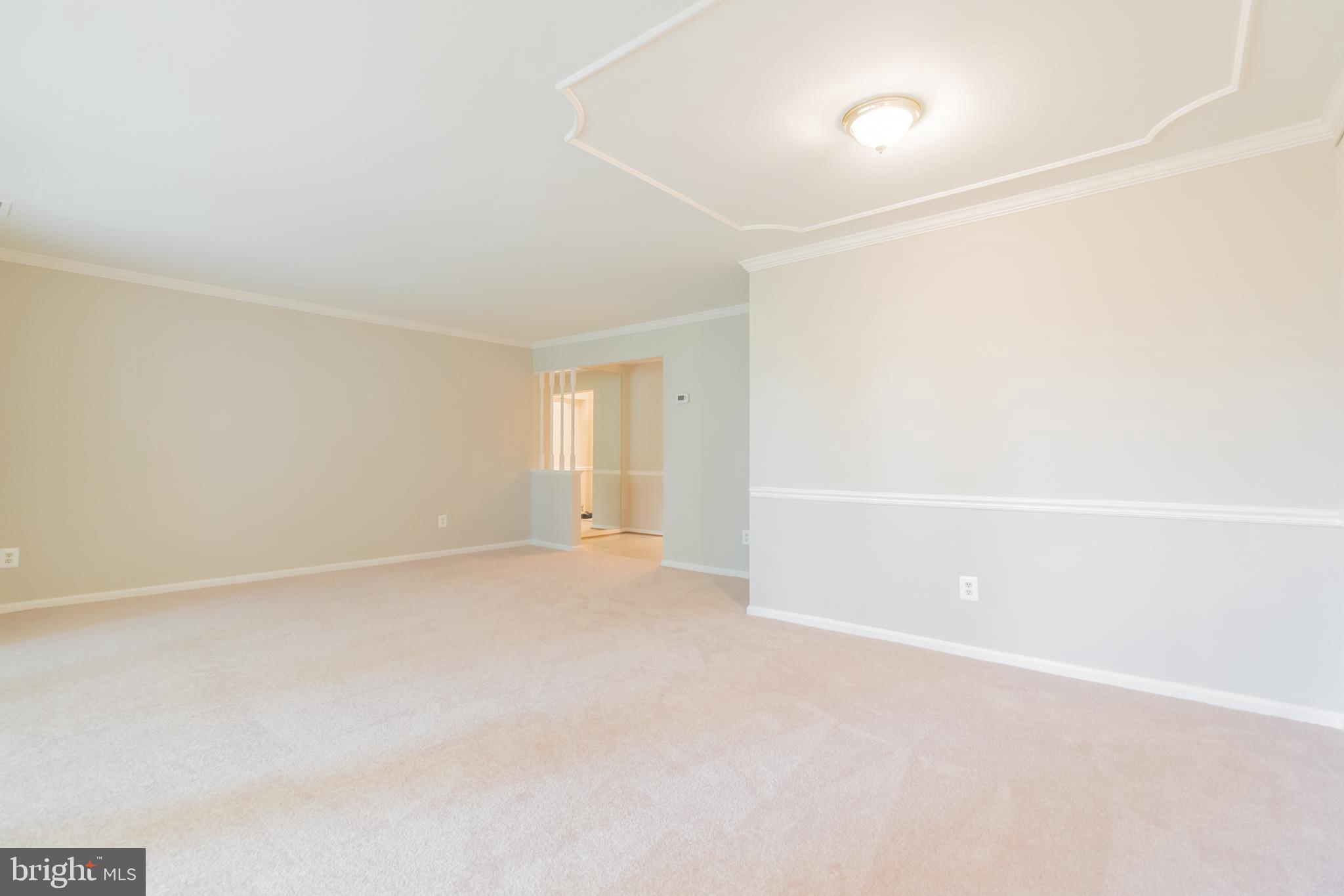 10717 Kings Riding Way, Unit 202 Rockville, MD 20852 - Photo 7 of 34 Dining room and living room toward foyer