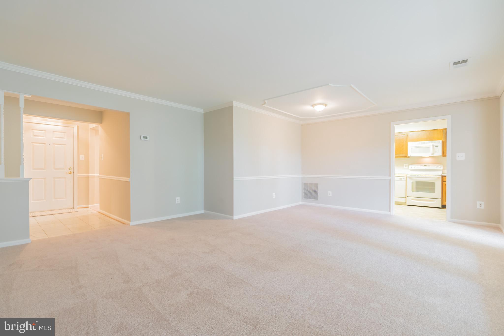 10717 Kings Riding Way, Unit 202 Rockville, MD 20852 - Photo 8 of 34 Living room toward kitchen and foyer
