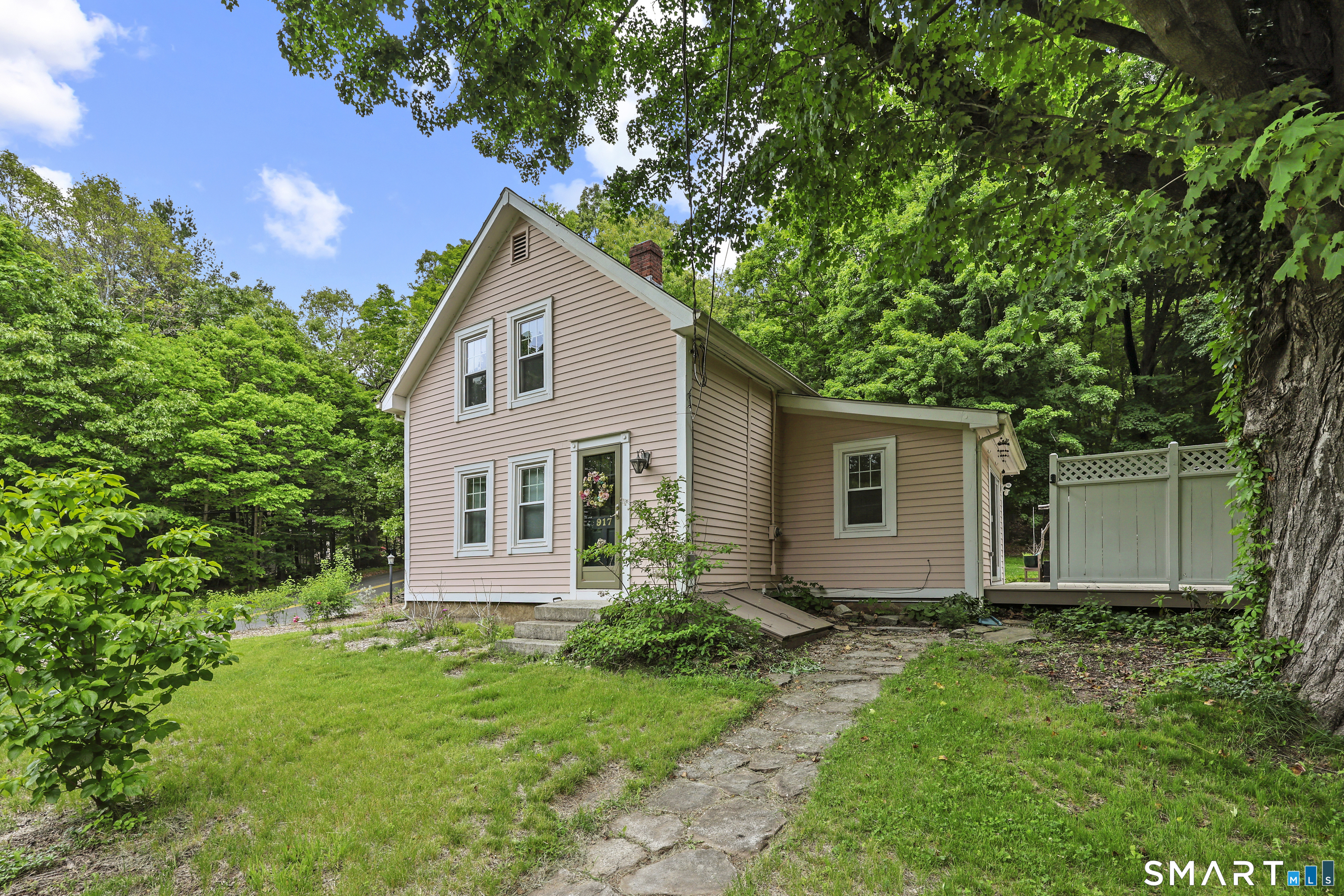 917 Hopewell Road Glastonbury, CT 06033 - Photo 1 of 39 a house with trees in the background