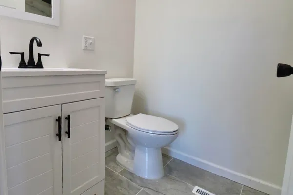 a bathroom with a toilet and a sink