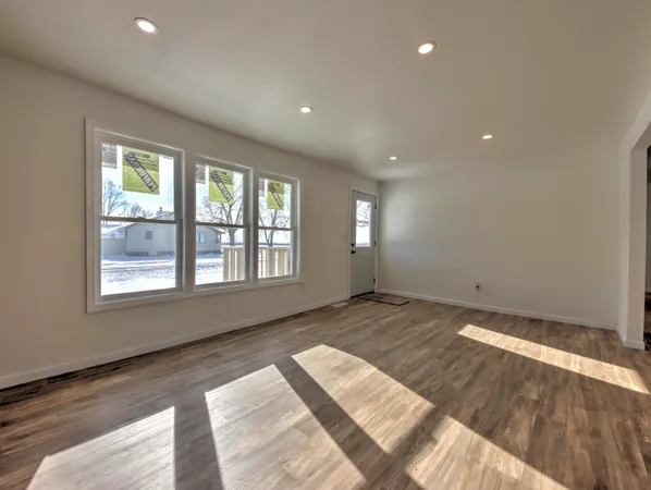 a view of an empty room and window