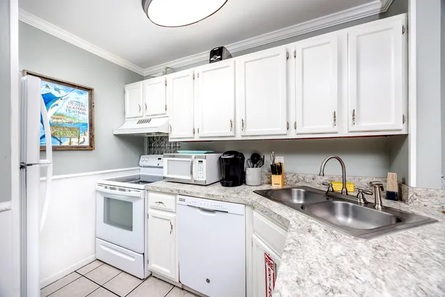 a view of a dining room with a table and chairs