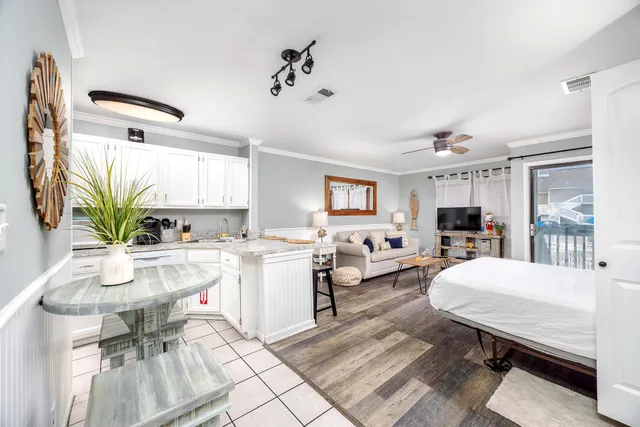a kitchen with a sink cabinets and window
