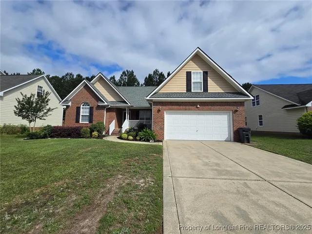 a front view of a house with yard