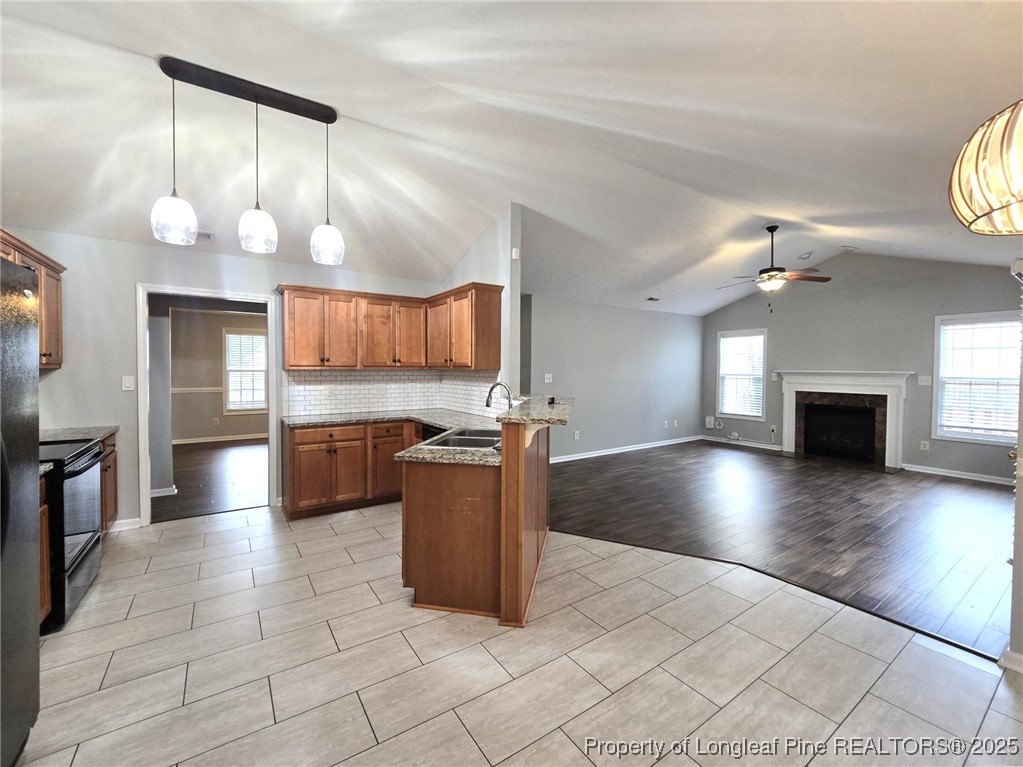 4158 Redspire Lane Fayetteville, NC 28306 - Photo 14 of 34 a view of a kitchen with a sink and a stove top oven