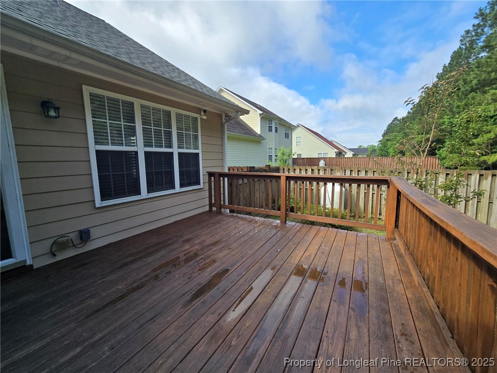 4158 Redspire Lane Fayetteville, NC 28306 - Photo 18 of 34 a view of deck with wooden floor and fence