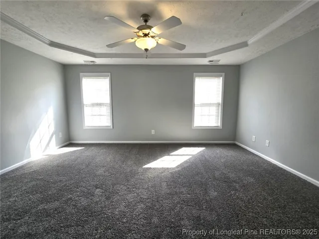 a spacious bathroom with a granite countertop sink mirror and bathtub