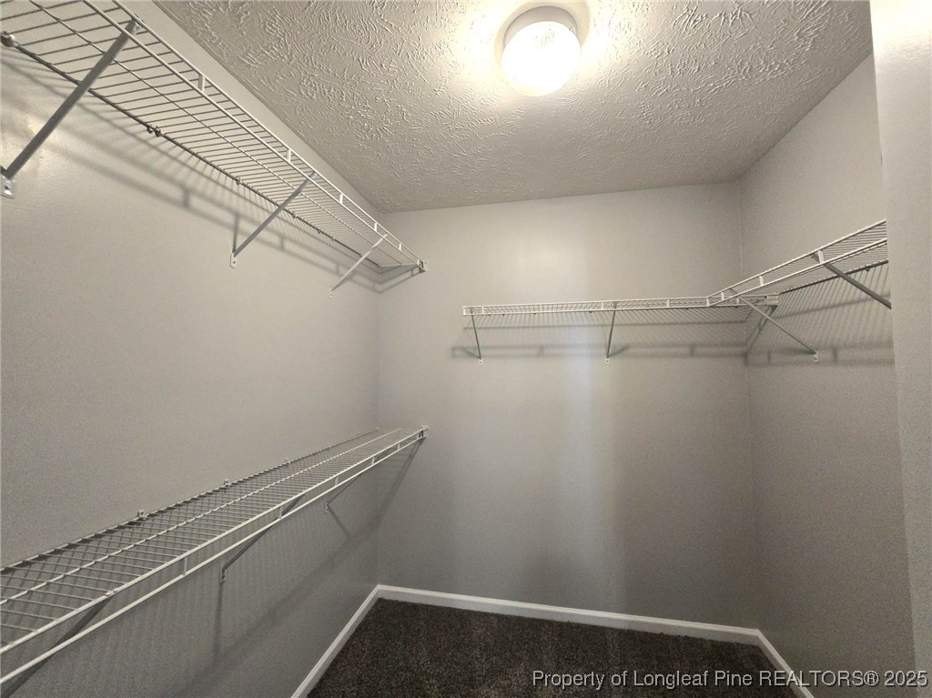 4158 Redspire Lane Fayetteville, NC 28306 - Photo 26 of 34 a view of a room with racks on the wall