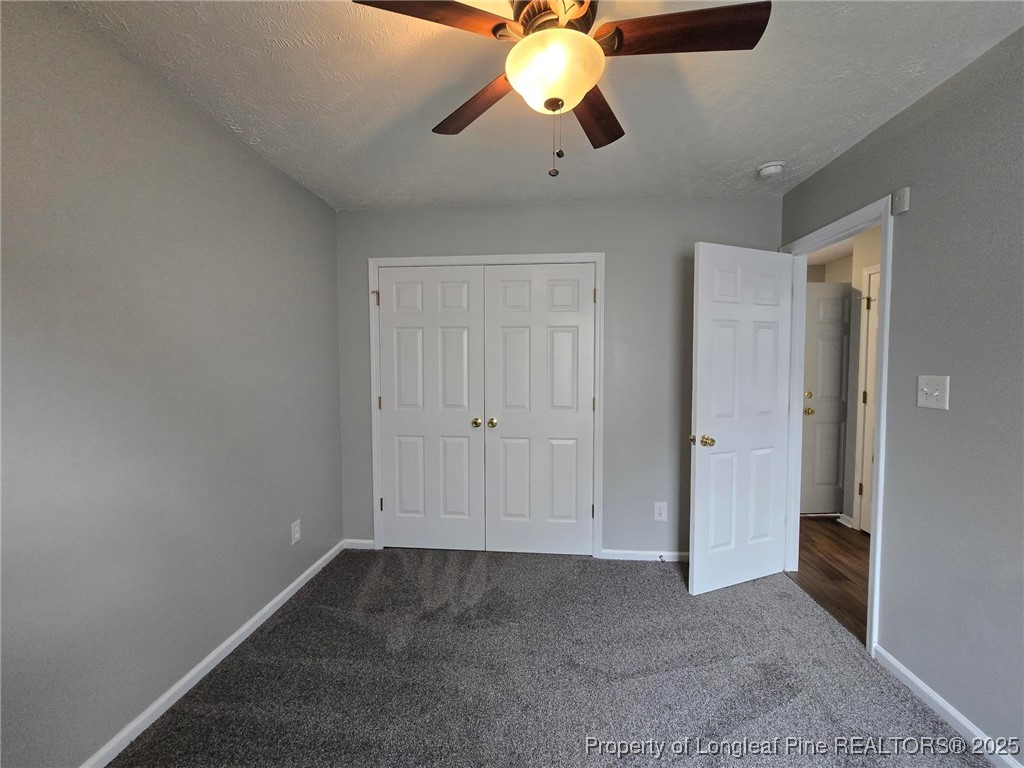4158 Redspire Lane Fayetteville, NC 28306 - Photo 32 of 34 a view of an empty room and chandelier fan