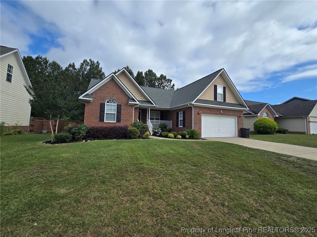 4158 Redspire Lane Fayetteville, NC 28306 - Photo 4 of 34 a front view of a house with a garden