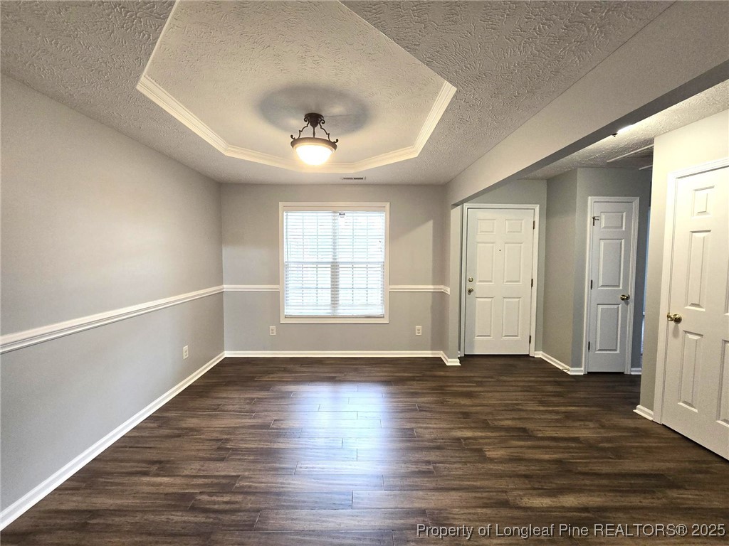 4158 Redspire Lane Fayetteville, NC 28306 - Photo 7 of 34 an empty room with wooden floor and windows