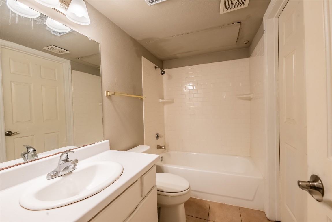 501 West 26th Street, Unit 106 Austin, TX 78705 - Photo 11 of 13 a bathroom with a sink toilet and shower