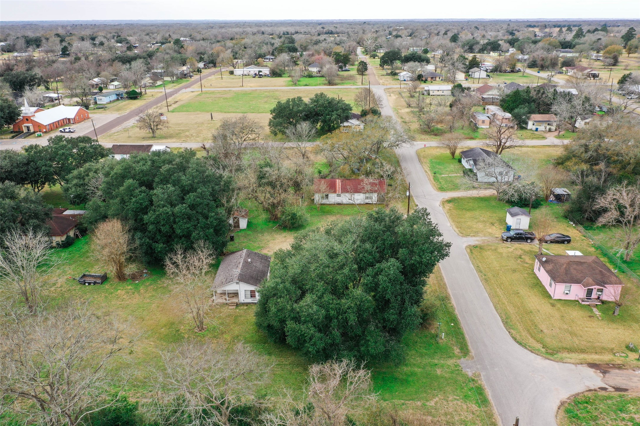 Tbd 17th Street Hempstead, TX 77445 - Photo 7 of 11 an aerial view of residential houses with outdoor space and trees