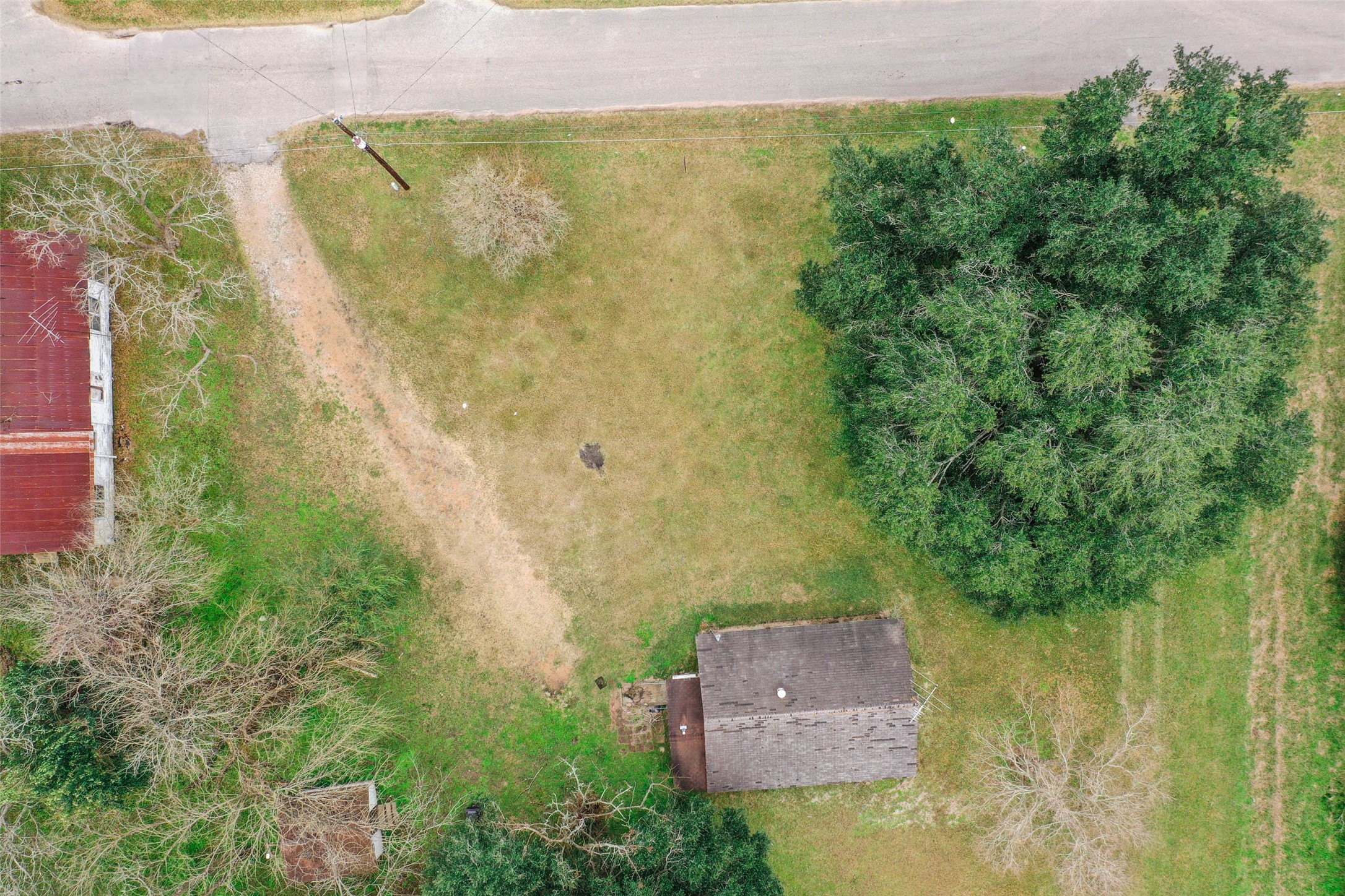 Tbd 17th Street Hempstead, TX 77445 - Photo 8 of 11 an aerial view of residential house with outdoor space and trees all around