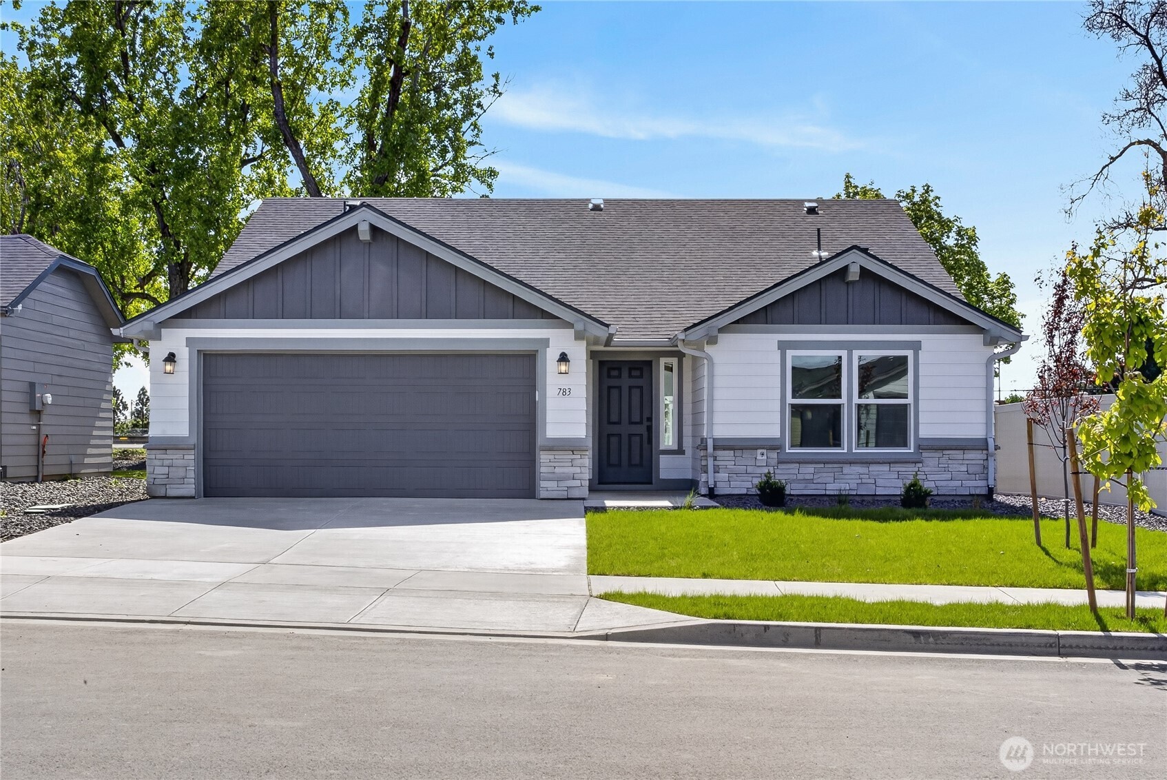 783 Ava Street Walla Walla, WA 99362 - Photo 1 of 12 a front view of a house with a yard and garage