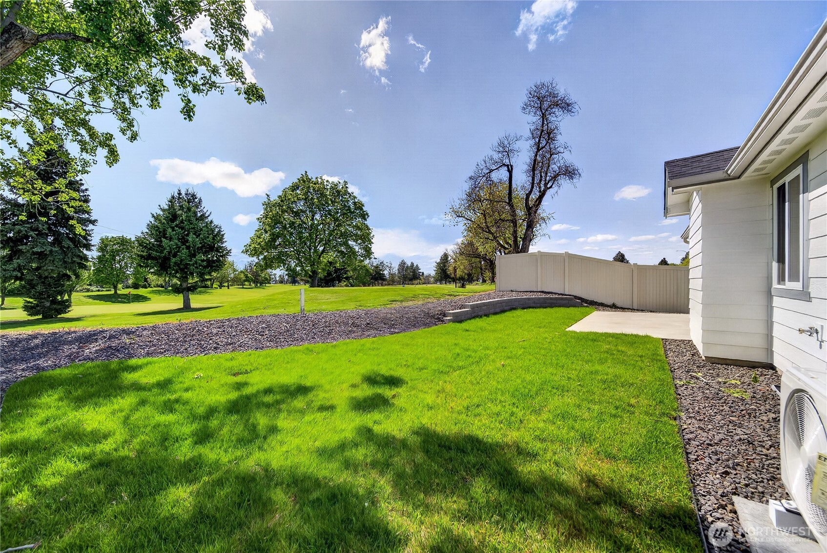 783 Ava Street Walla Walla, WA 99362 - Photo 11 of 12 a view of a house with a big yard and potted plants