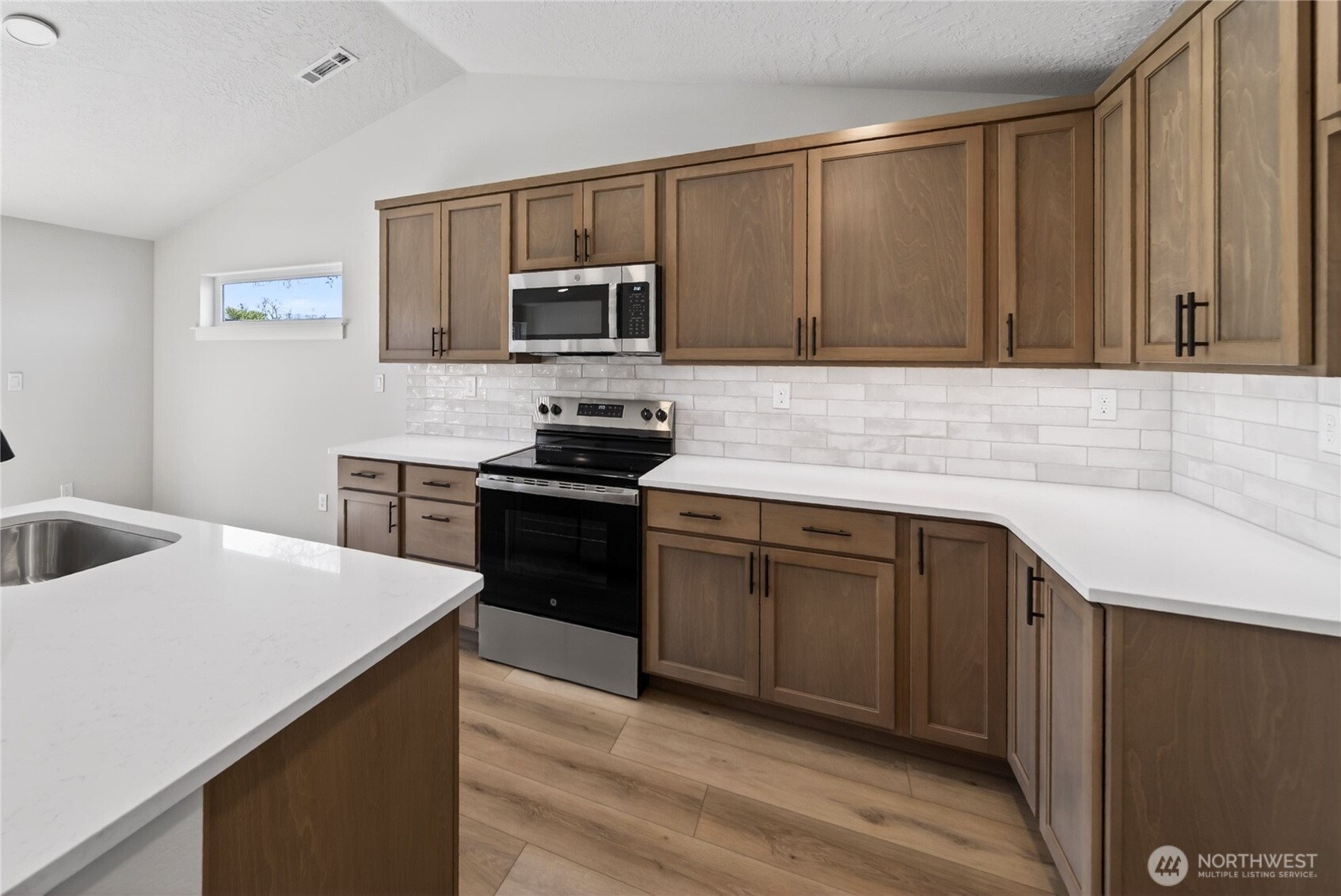 783 Ava Street Walla Walla, WA 99362 - Photo 2 of 12 a kitchen with stainless steel appliances granite countertop a sink stove and microwave