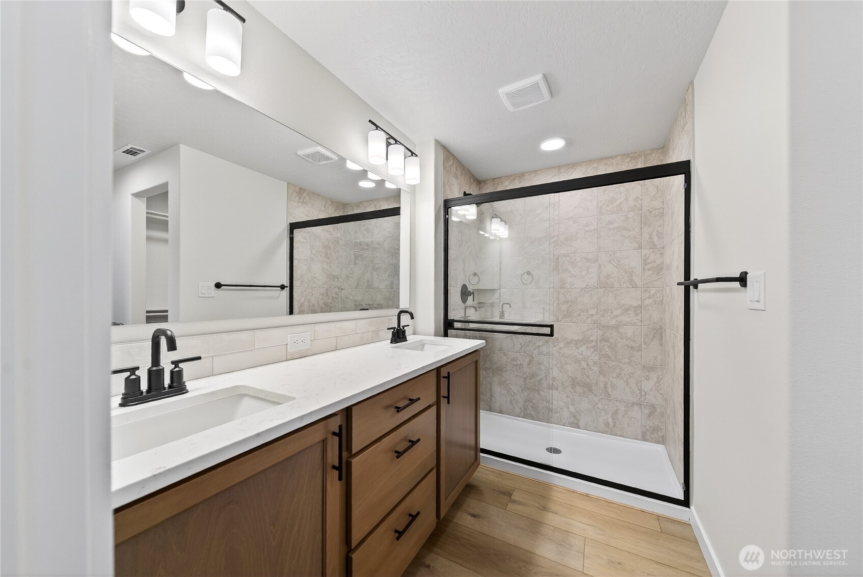 783 Ava Street Walla Walla, WA 99362 - Photo 7 of 12 a bathroom with a granite countertop sink mirror and double