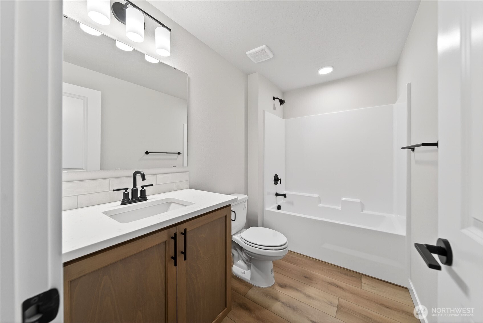 783 Ava Street Walla Walla, WA 99362 - Photo 10 of 12 a bathroom with a sink a toilet and shower