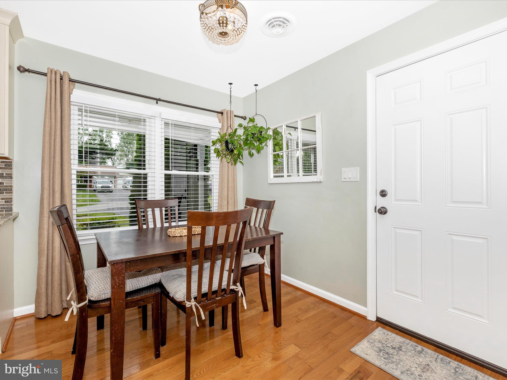 9204 Oak Tree Circle Frederick, MD 21701 - Photo 16 of 58 a view of a dining room with furniture window and outside view