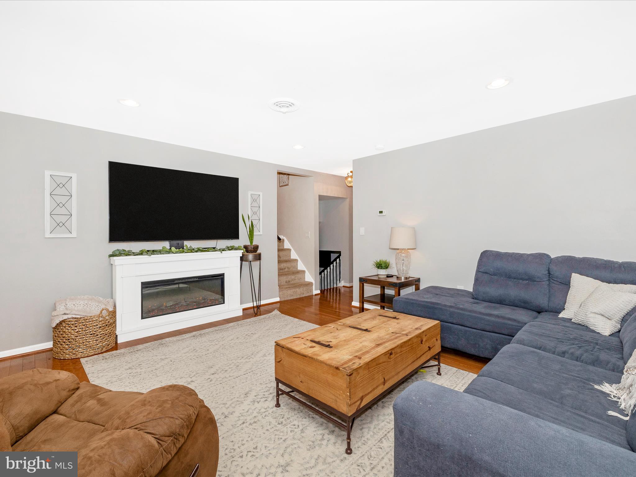 9204 Oak Tree Circle Frederick, MD 21701 - Photo 20 of 58 a living room with furniture and a flat screen tv