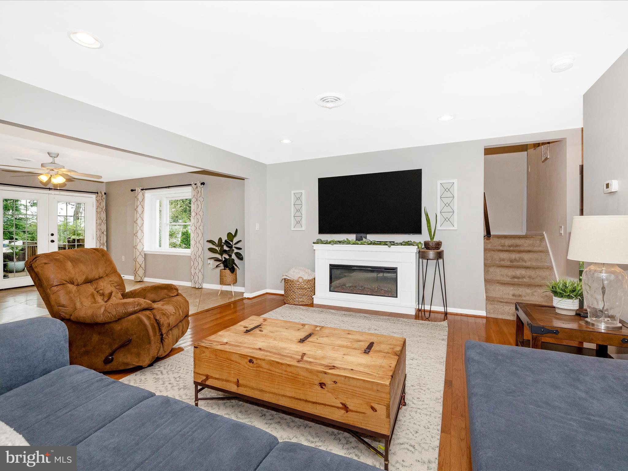 9204 Oak Tree Circle Frederick, MD 21701 - Photo 21 of 58 a living room with furniture flat screen tv and a fireplace