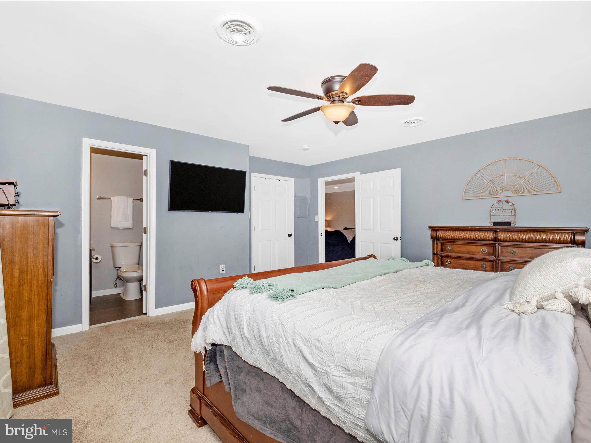 9204 Oak Tree Circle Frederick, MD 21701 - Photo 26 of 58 a bedroom with a bed and a flat screen tv