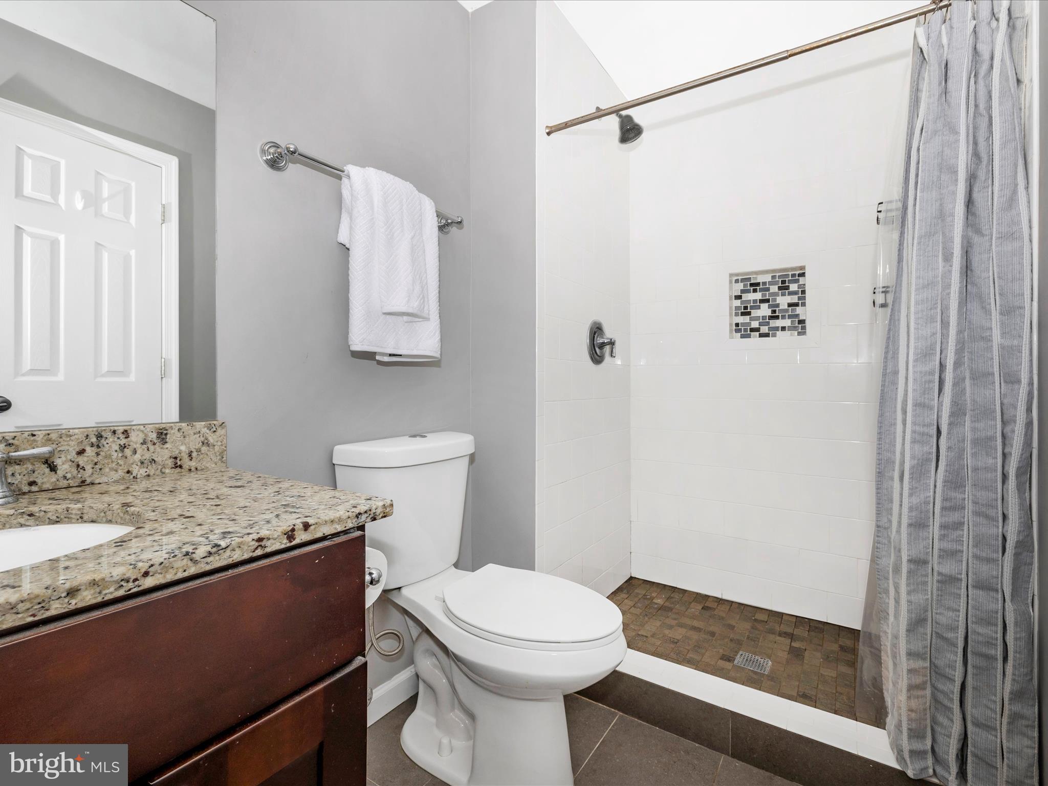 9204 Oak Tree Circle Frederick, MD 21701 - Photo 29 of 58 a bathroom with a sink and a toilet