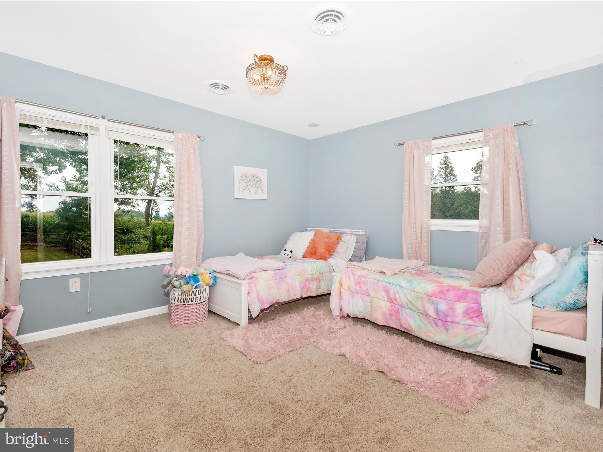 9204 Oak Tree Circle Frederick, MD 21701 - Photo 31 of 58 a bedroom with a bed and a window