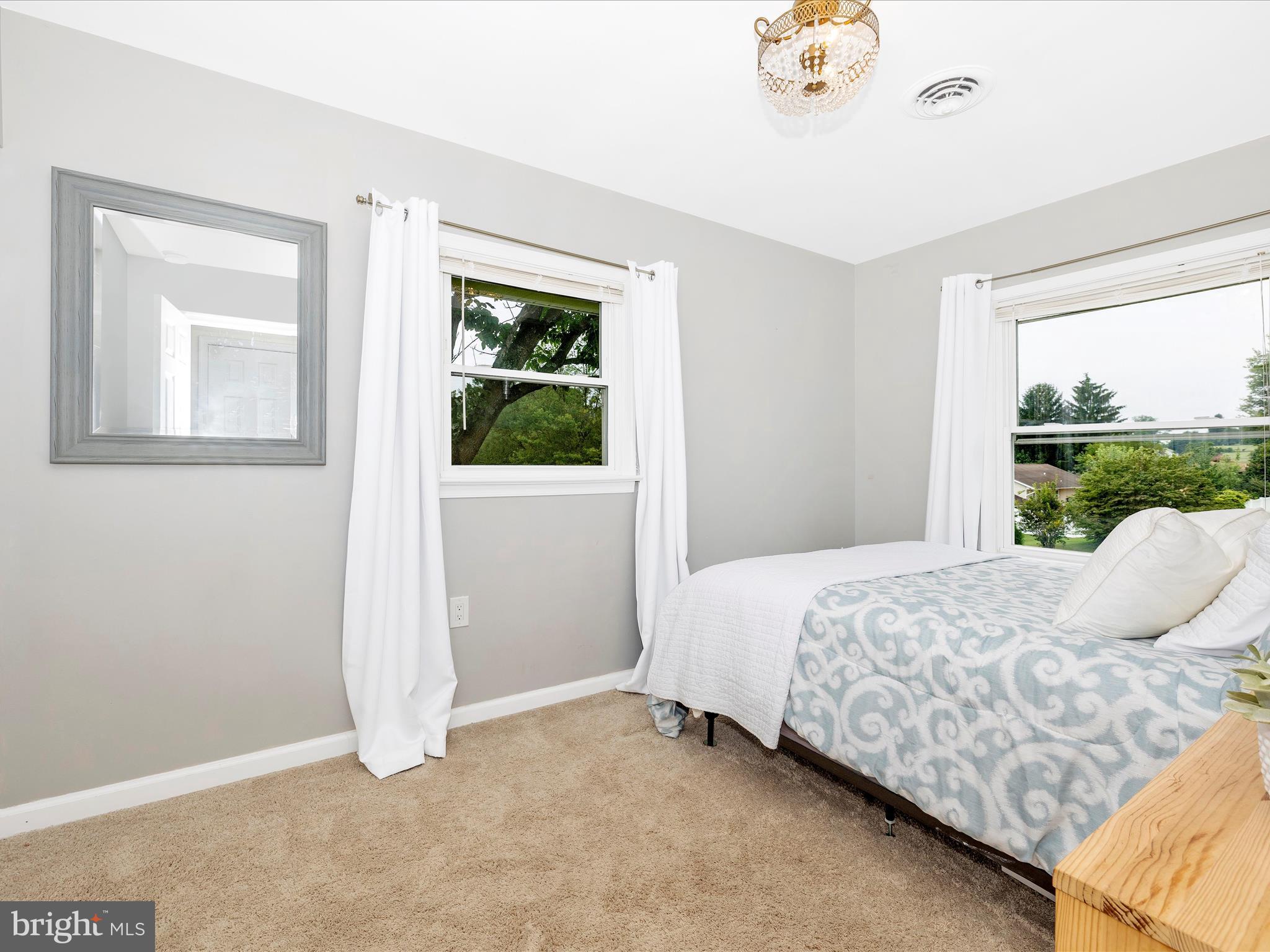 9204 Oak Tree Circle Frederick, MD 21701 - Photo 33 of 58 a bedroom with a bed and a window