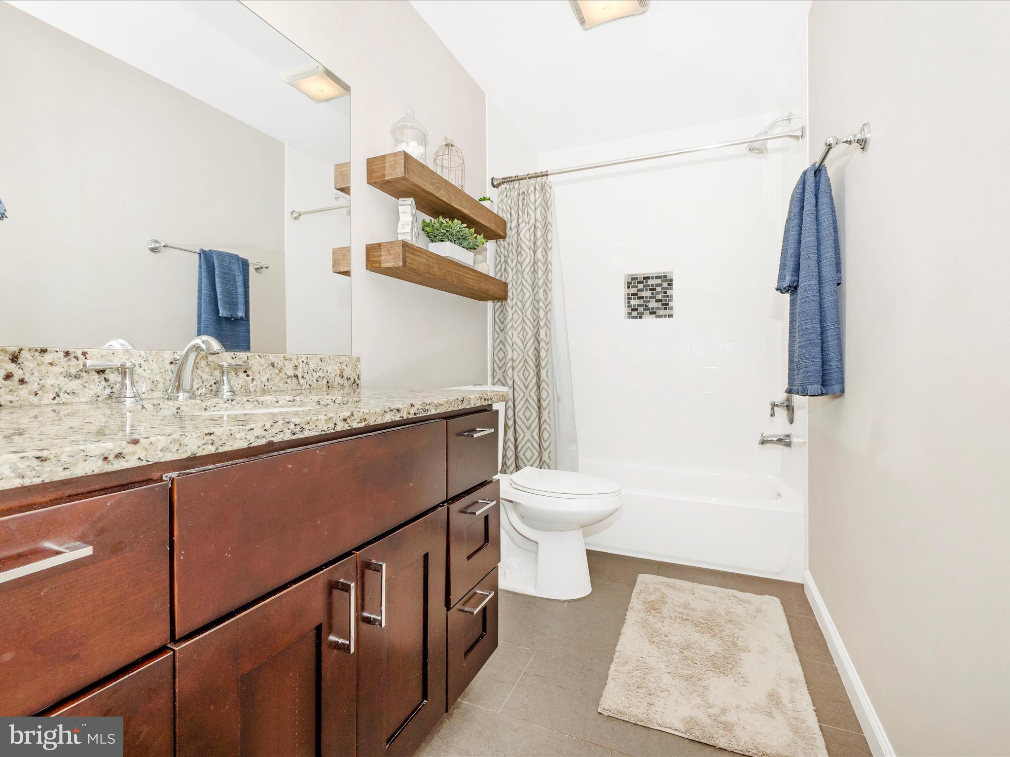 9204 Oak Tree Circle Frederick, MD 21701 - Photo 37 of 58 a bathroom with a sink and a toilet