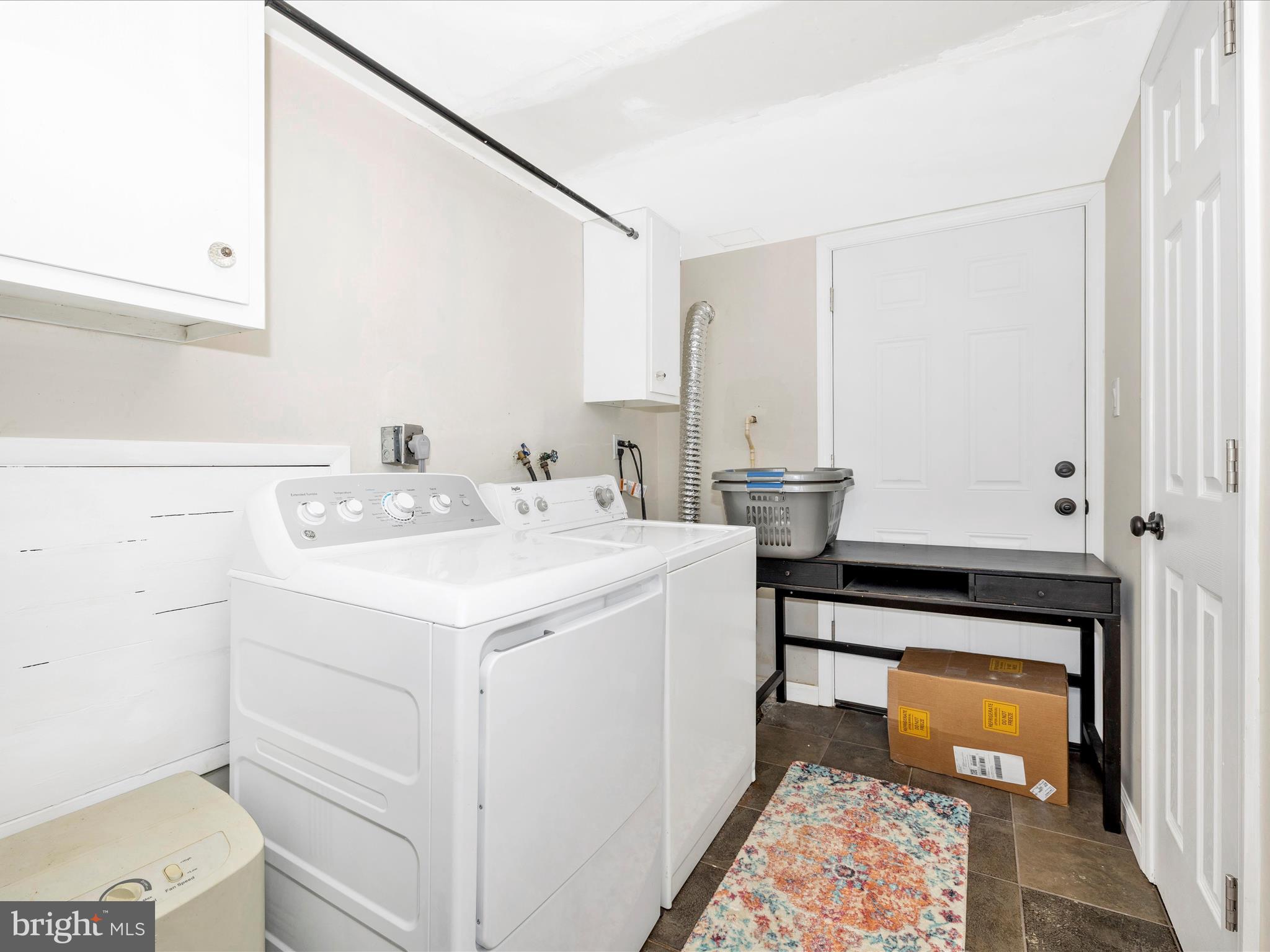 9204 Oak Tree Circle Frederick, MD 21701 - Photo 41 of 58 a utility room with cabinets washer and dryer