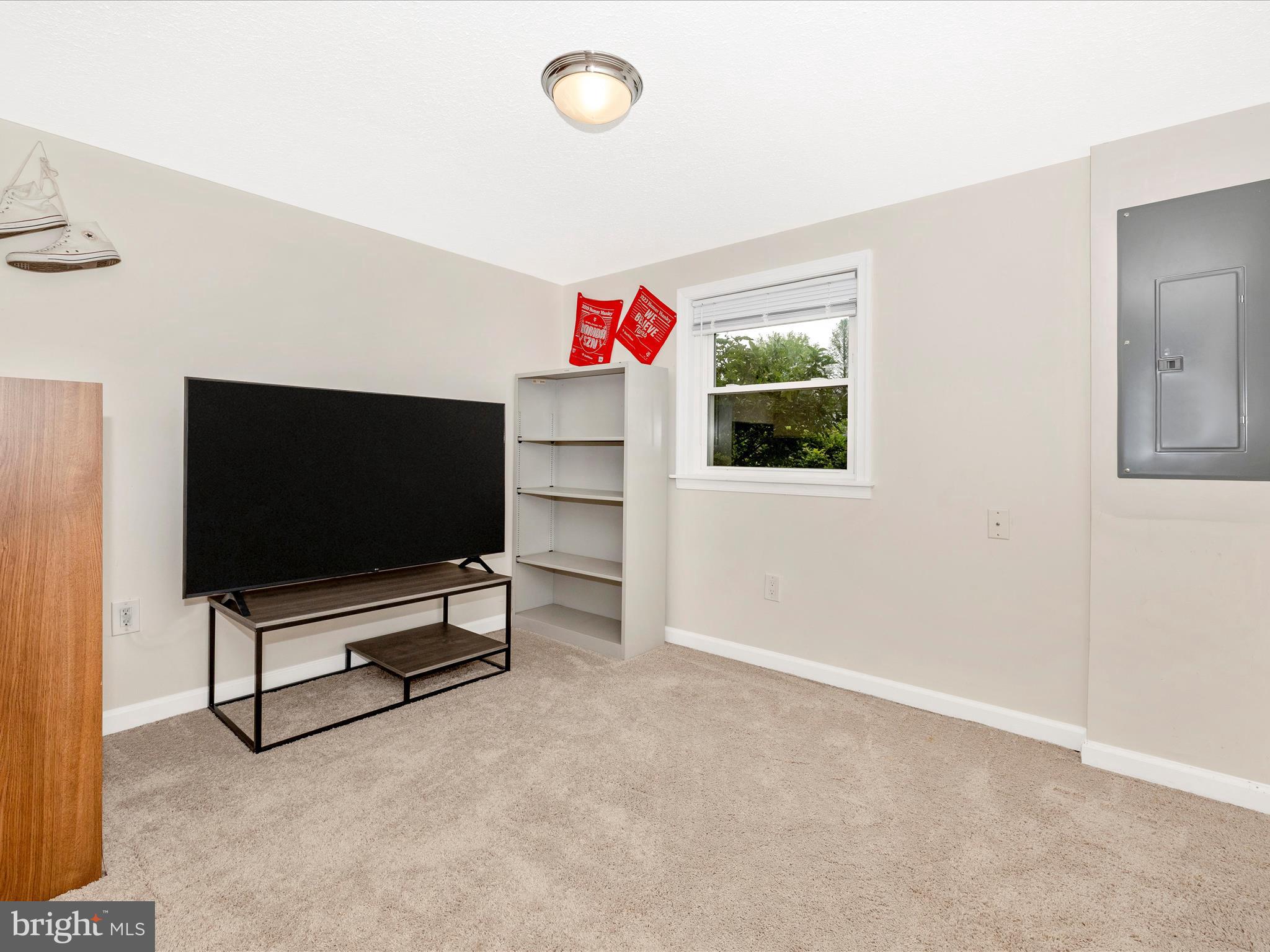 9204 Oak Tree Circle Frederick, MD 21701 - Photo 42 of 58 a living room with furniture and a flat screen tv