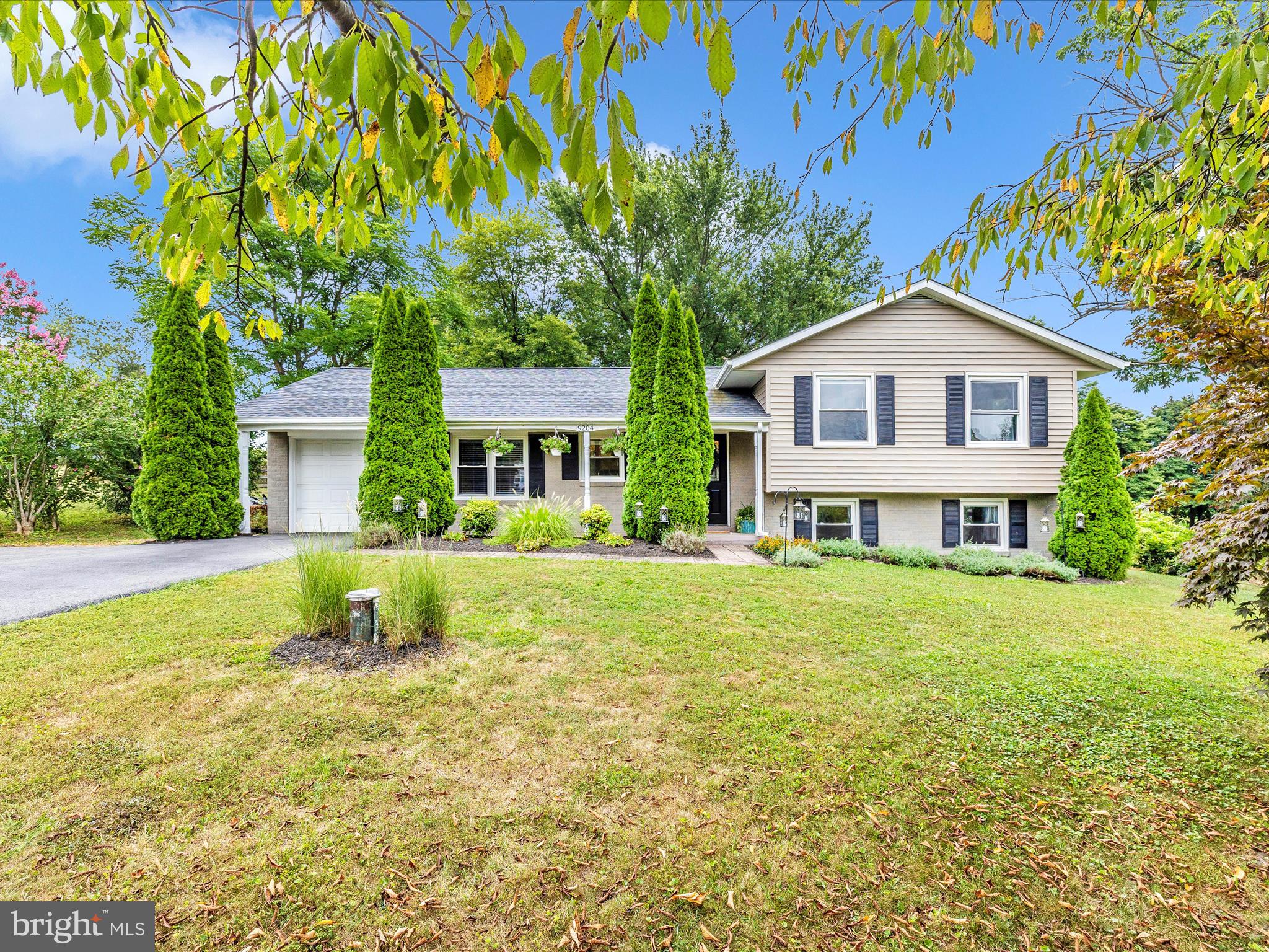 9204 Oak Tree Circle Frederick, MD 21701 - Photo 47 of 58 a front view of a house with a yard