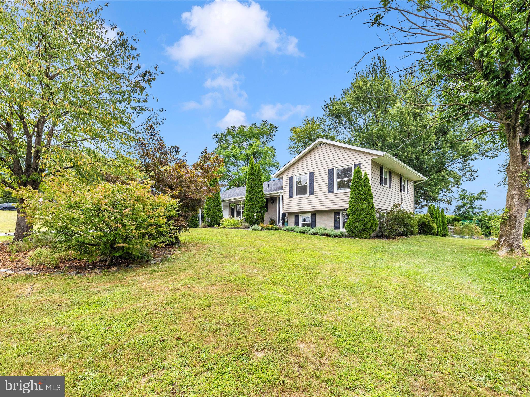 9204 Oak Tree Circle Frederick, MD 21701 - Photo 49 of 58 a front view of house with yard and trees