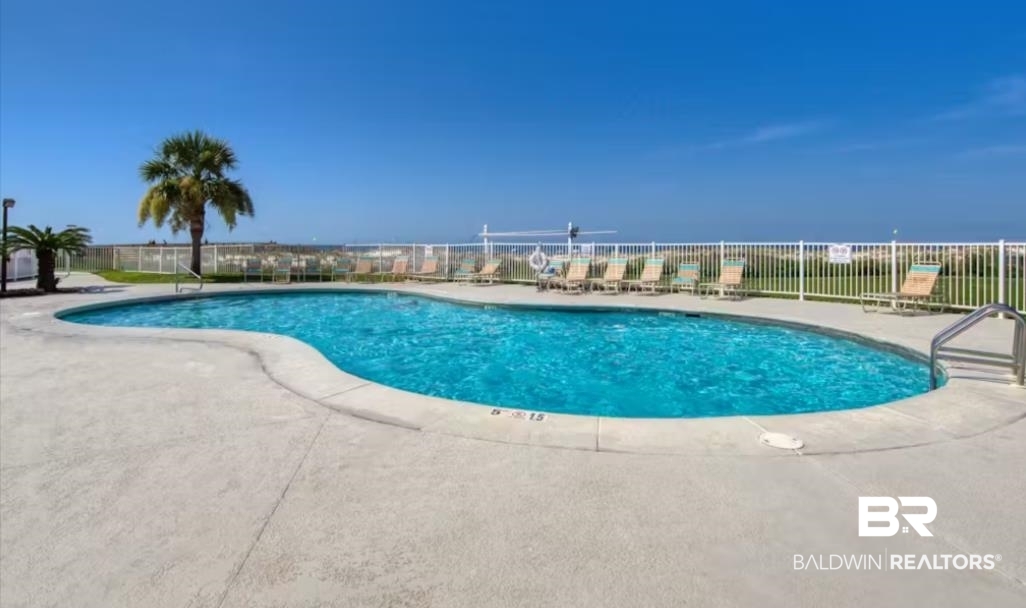375 Plantation Road, Unit 5814 Gulf Shores, AL 36542 - Photo 21 of 31 View of swimming pool with a patio area and a water view