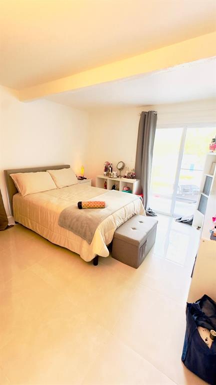 14614 Bayonne Road Orlando, FL 32832 - Photo 13 of 23 a spacious bedroom with a bed and a couch