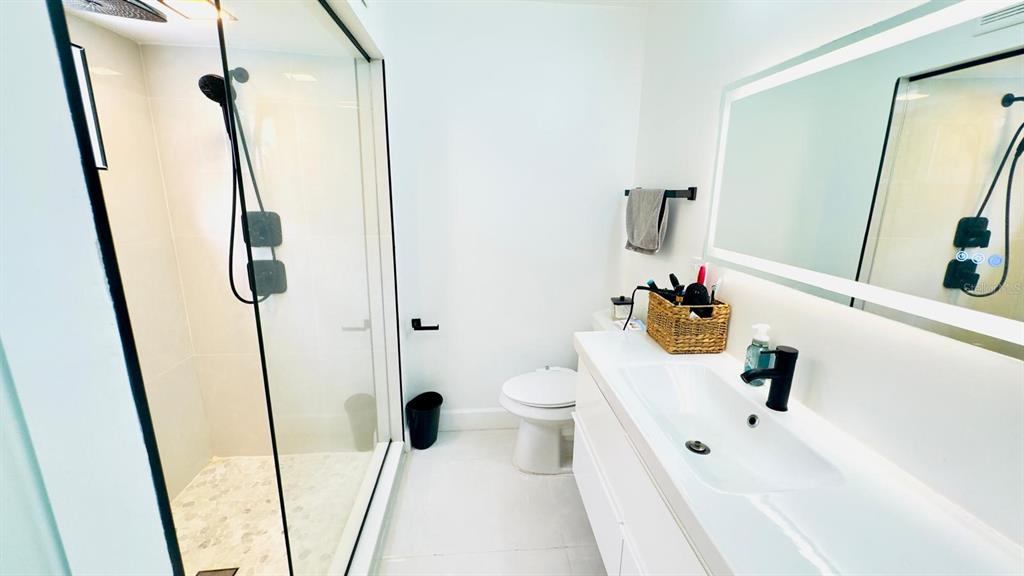 14614 Bayonne Road Orlando, FL 32832 - Photo 19 of 23 a bathroom with a sink and a mirror