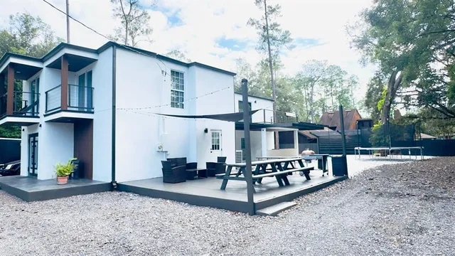 a view of a house with a wooden deck