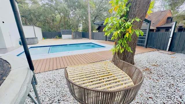 a view of balcony with wooden floor and outdoor seating