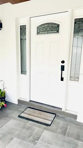 a view of a hallway with paintings on the wall
