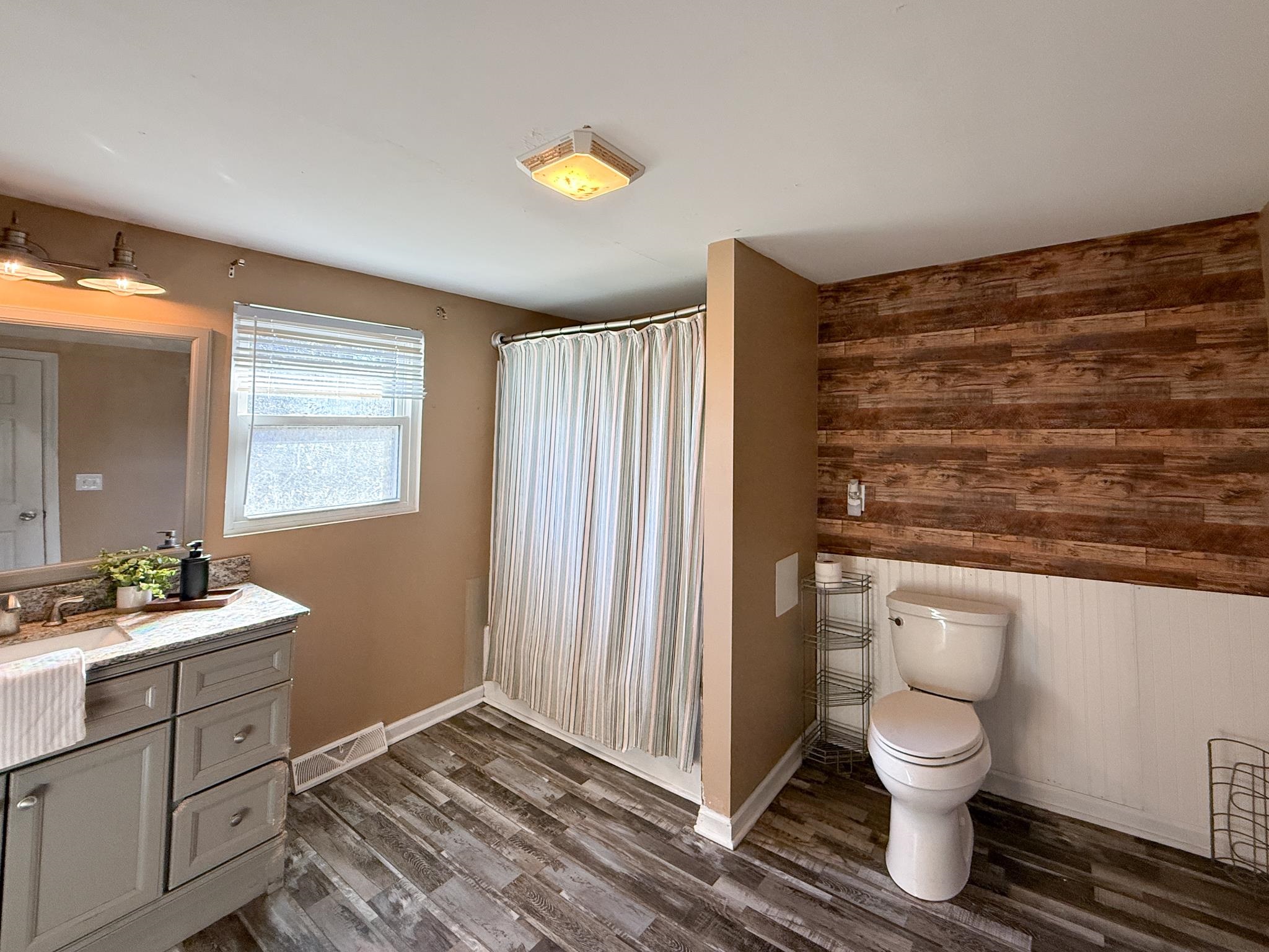 13 Indian Ridge Road Greenville, VA 24440 - Photo 11 of 17 a bathroom with a toilet sink and mirror