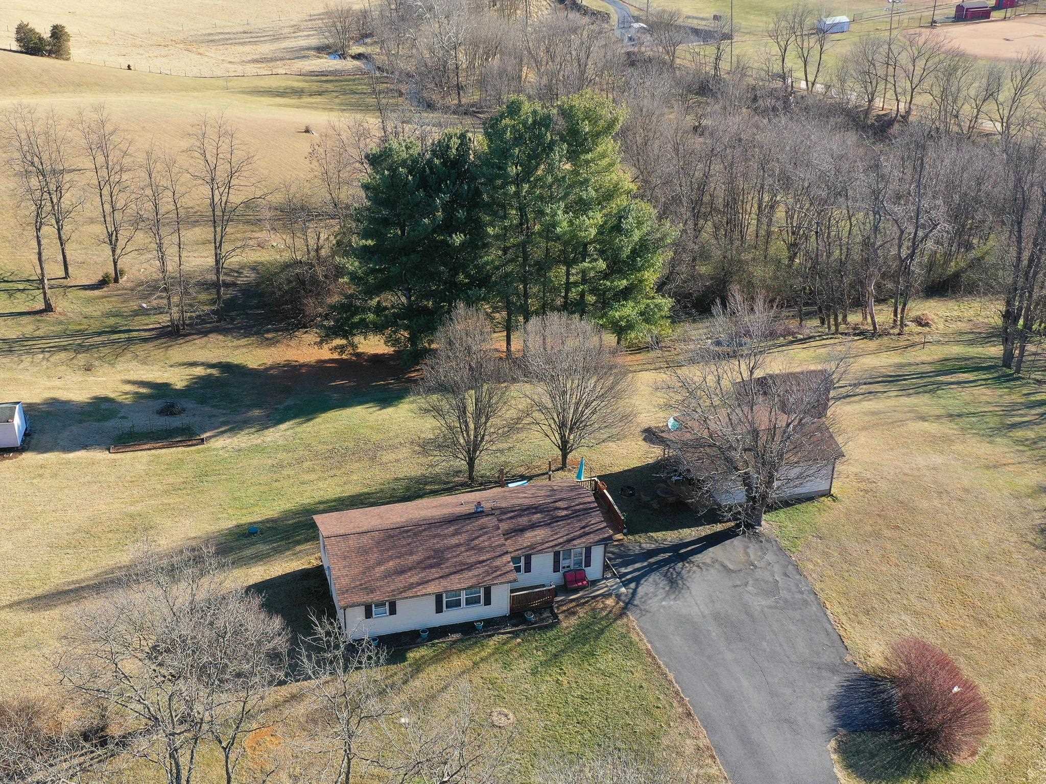 13 Indian Ridge Road Greenville, VA 24440 - Photo 3 of 17 a view of a backyard with lawn chairs