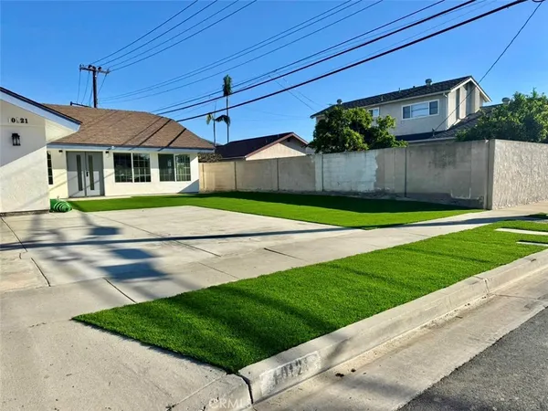 a living room with furniture and large window