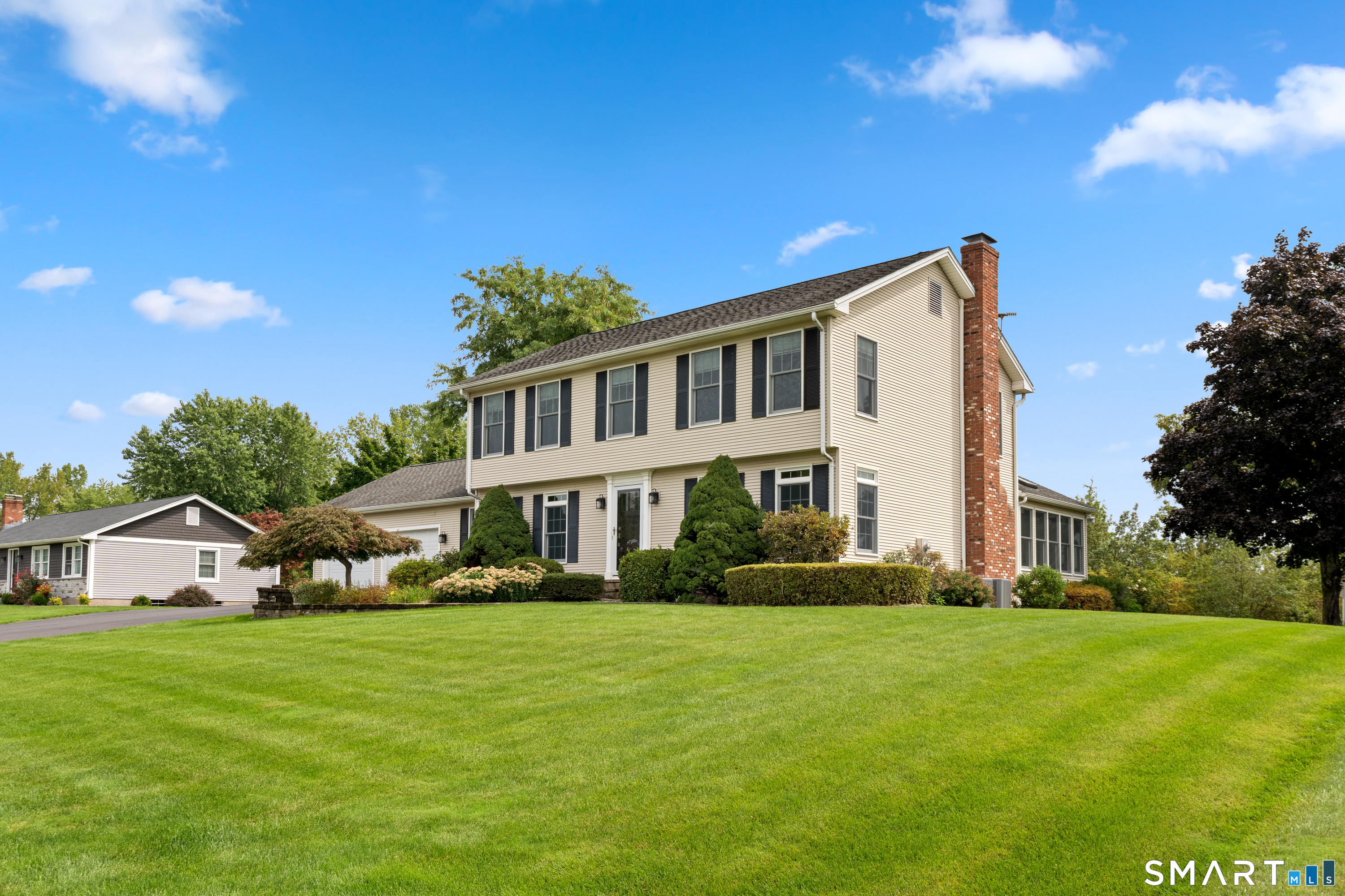 71 Quail Run Road Suffield, CT 06078 - Photo 2 of 40 Beautiful landscaping surrounds the home.