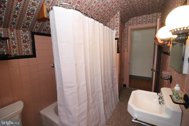 a bathroom with a sink and toilet
