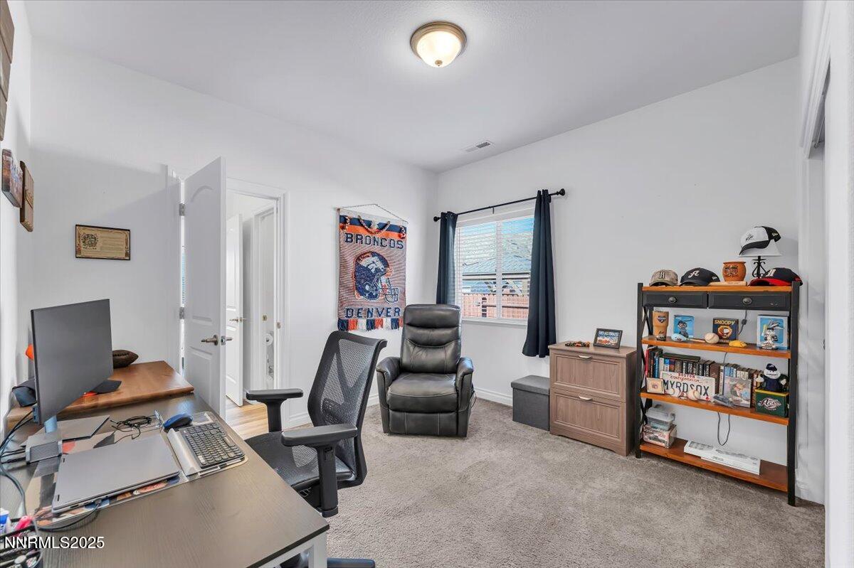 18722 Knott Crk Court Reno, NV 89508 - Photo 24 of 56 a room with furniture and a flat screen tv